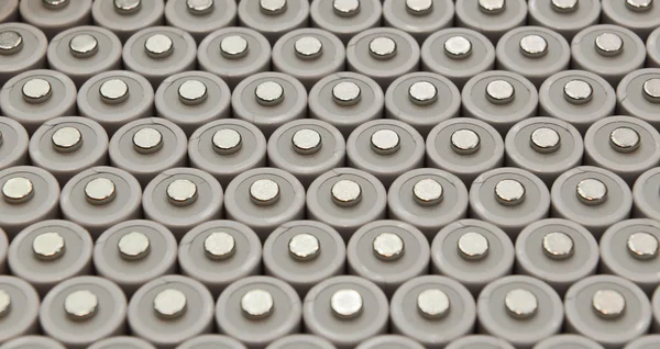 Several AA batteries in perspective closeup view — Stock Photo, Image