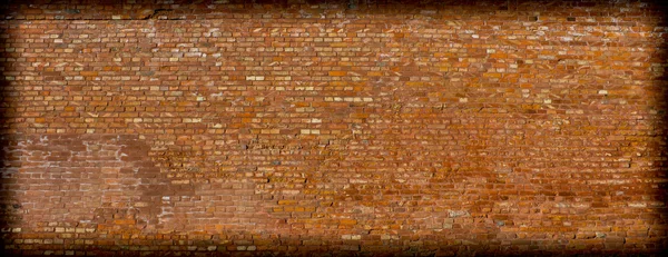 Υφή φόντου από έναν τοίχο από τούβλα με πιο σκούρα βινιέτα — Φωτογραφία Αρχείου