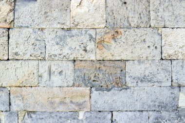 Eski bir taş duvarın parçası, arka plan veya doku için..
