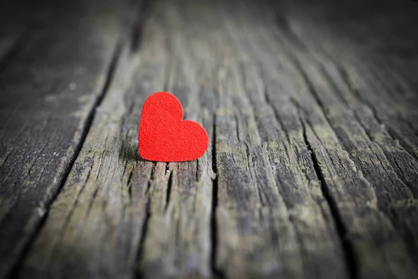 Red heart on wooden background Stock Image