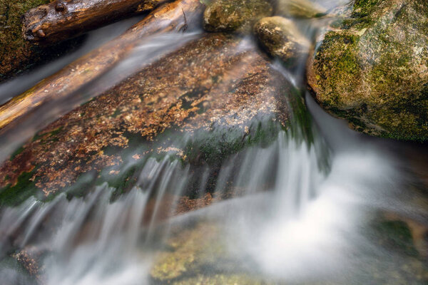 Mountain stream with stones with clear water.