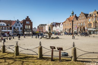 Market place in Husum with Tine fountain clipart