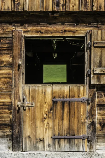 Wooden door of stable