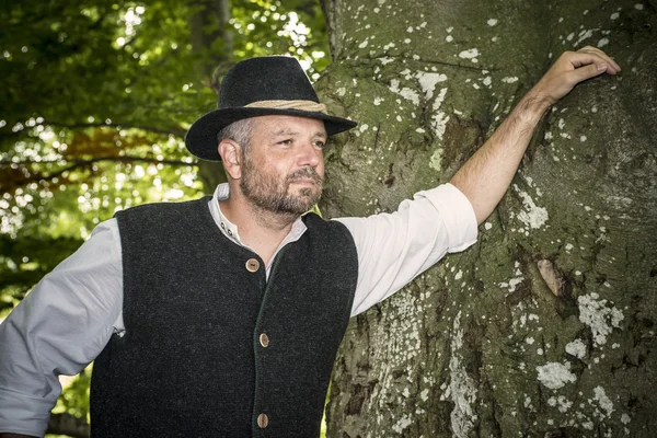 Man with traditional costume in forest — Stock Photo, Image