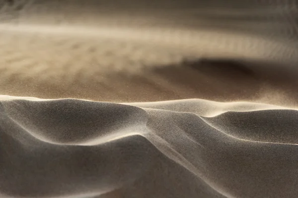 Flying grains of sand — Stock Photo, Image
