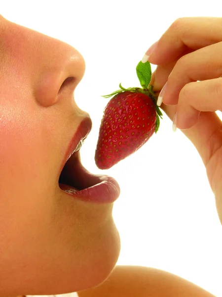 Young girl eating strawberry — Stock Photo, Image