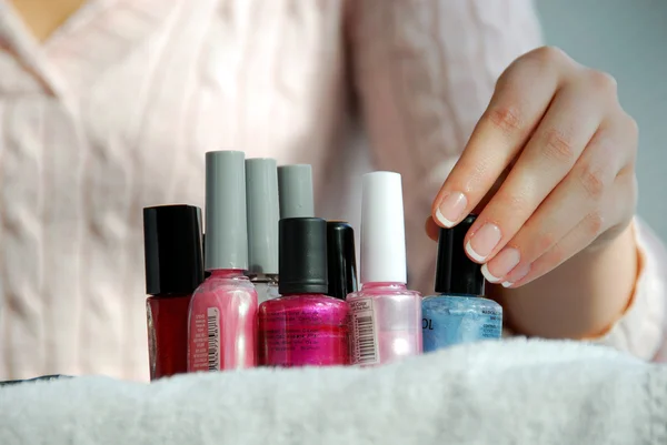 Woman in a nail salon receiving a manicure