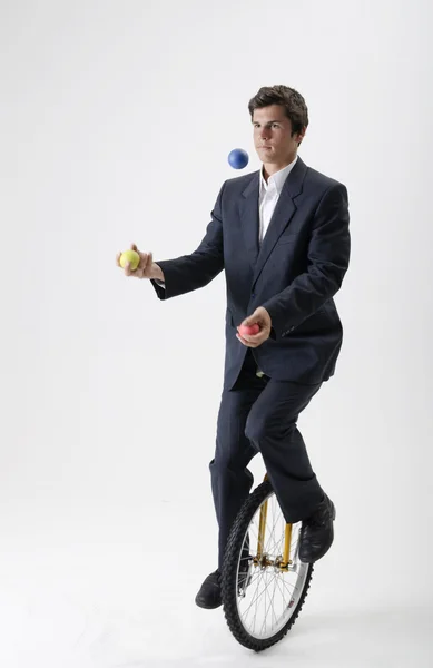 Żonglerka biznesmen na unicycle Obrazek Stockowy