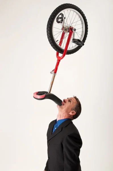 Businessman balancing unicycle Zdjęcie Stockowe