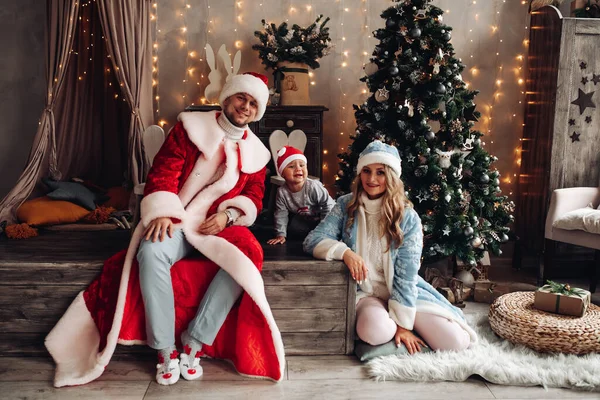Happy family wearing xmas festive costumes. — Stock Photo, Image