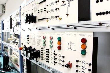 Control panels in an electronics lab clipart