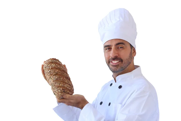 Piekarz uśmiechający się trzyma chleb razowy — Zdjęcie stockowe