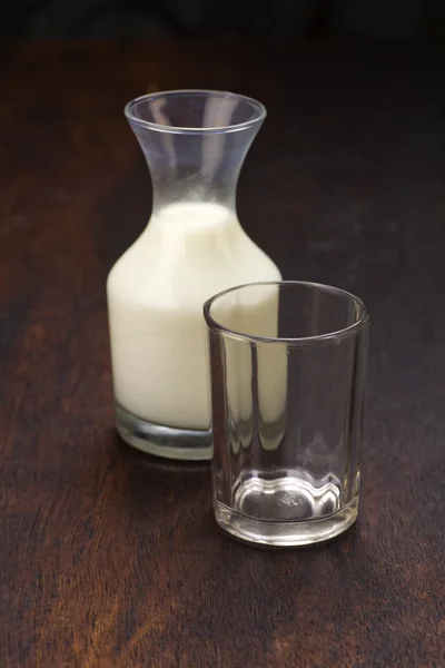 Bottle of milk on wooden background — Stock Photo, Image