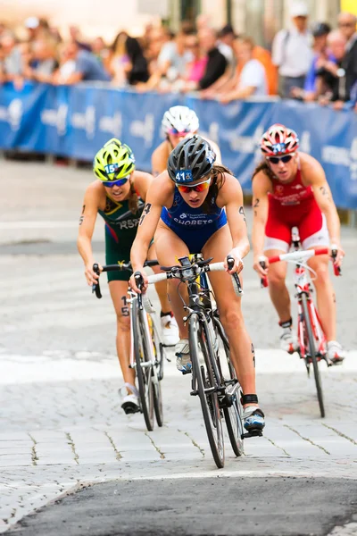 STOCKHOLM - AUG, 24: A group of female cyclist with Mariya Shorats in from after the transition from the swimming in the Womens ITU World Triathlon Series event Aug 24, 2013 in Stockholm, Sweden — Stock Photo, Image