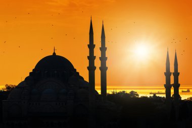Mosque silhouette during sunset clipart