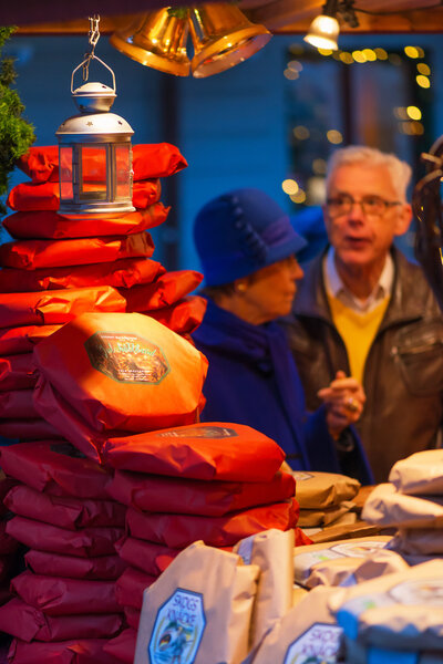 A older couple buying traditional bread at Stortorget Christmas market in Stockholm