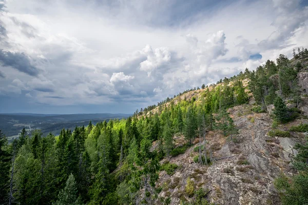 Sunlight at a mountainside during bad weather — Stock Photo, Image