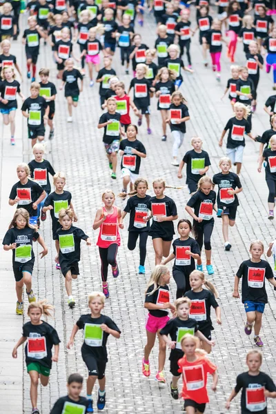 Happy children from above after the first curve of the youngest — Stock Photo, Image