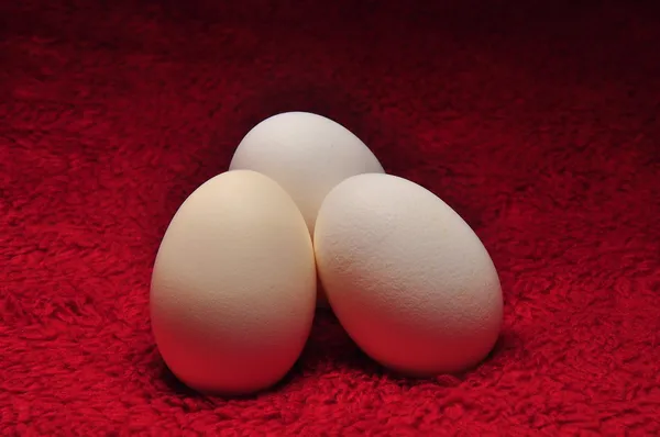 Three Eggs On Red Fabric — Stock Photo, Image