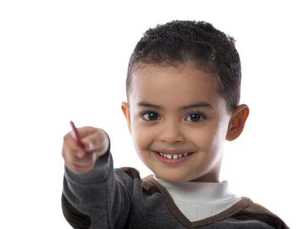 Glad liten pojke pekar med penna — Stockfoto