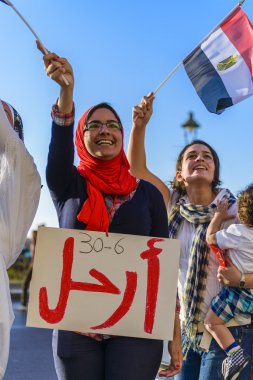 Egyptian Girl Protesting with LEAVE Sign clipart