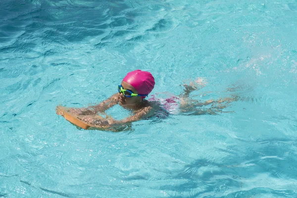 Little Young Girl Swimming in a Pool — Stock Photo, Image