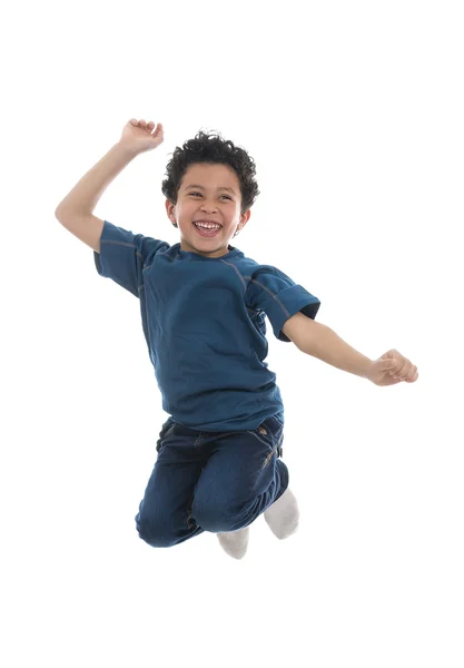 Ativo menino feliz saltando com alegria — Fotografia de Stock