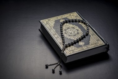 Quran Holy Book and Beads