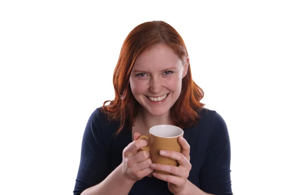 Smiling woman holding mug in both hands — Stock Photo, Image