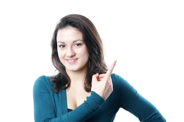 Mujer joven apuntando al copyspace —  Fotos de Stock