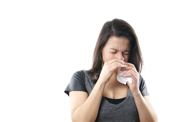 Young woman blowing nose — Stock Photo, Image