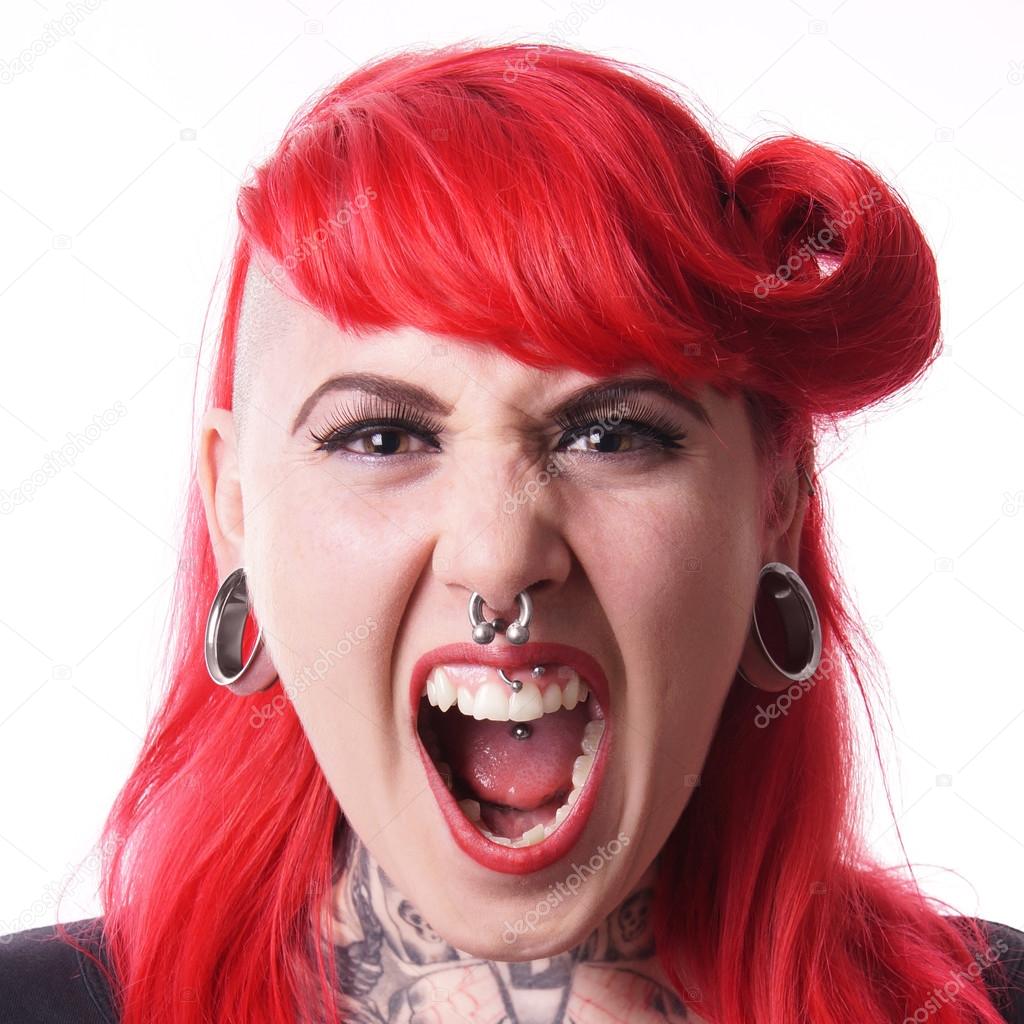 Woman with piercings screaming
