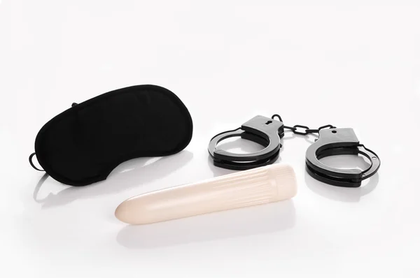 Mask handcuffs and vibrator — Stock Photo, Image