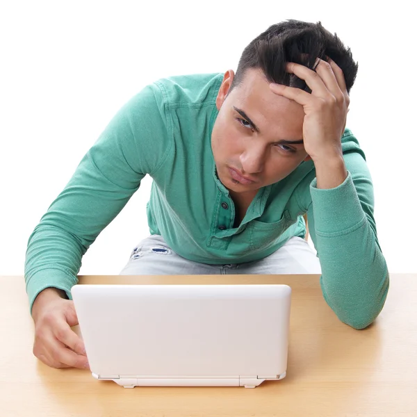 Desperate man with netbook Stock Photo
