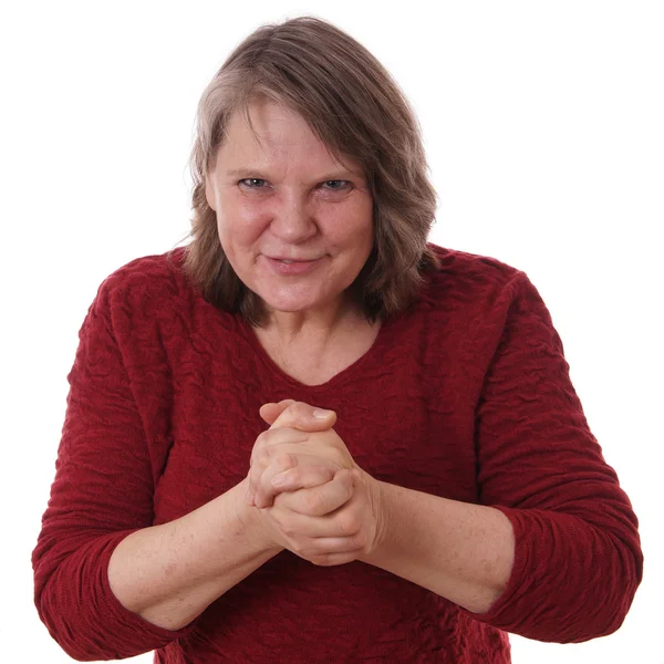 Mature woman rubbing hands — Stock Photo, Image