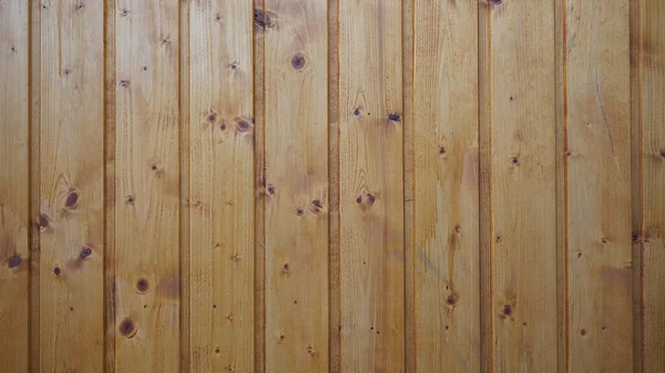 Stained wood background with vertical wooden board panelling — стоковое фото