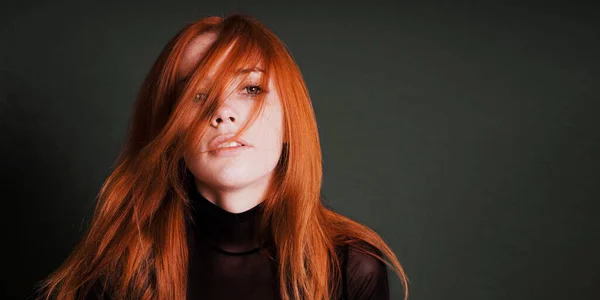 Sensual portrait of young woman with wild red hair — Stockfoto