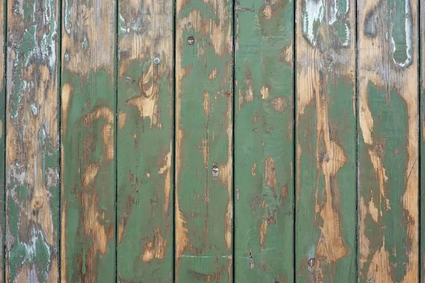 緑のペンキのパティーナのテクスチャと古い風化した木製の背景 — ストック写真