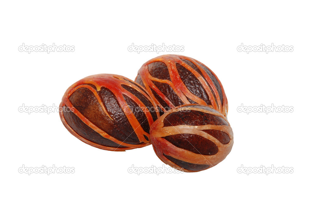 Three whole nutmeg seeds covered in mace — Stock Photo © sarahdoow
