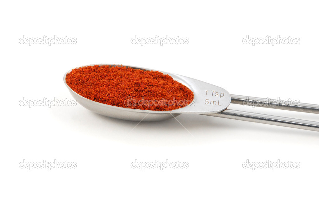 Chilli powder measured in a metal teaspoon — Stock Photo © sarahdoow