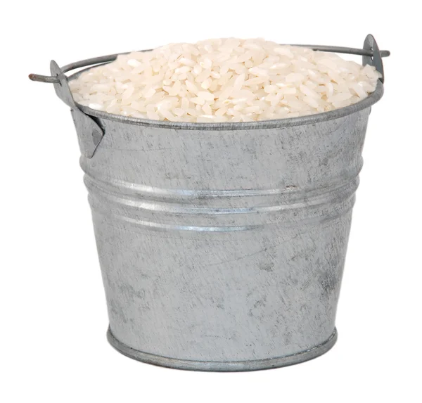 White long grain rice in a miniature metal bucket — Stock Photo, Image