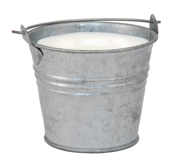 Milk in a miniature metal bucket — Stock Photo, Image