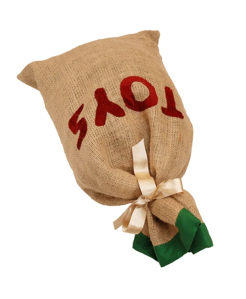 Father Christmas's hessian toy sack tied with a ribbon lying fla — Stock Photo, Image