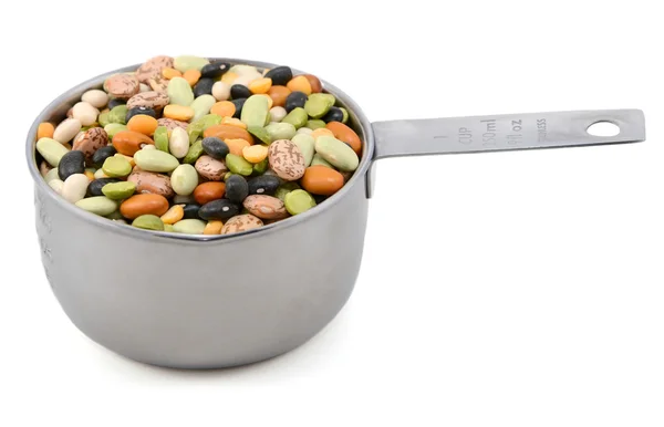 Mixed dried beans in a metal cup measure — Stock Photo, Image