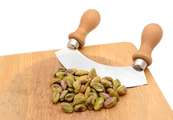 Whole pistachios with a rocking knife — Stock Photo, Image