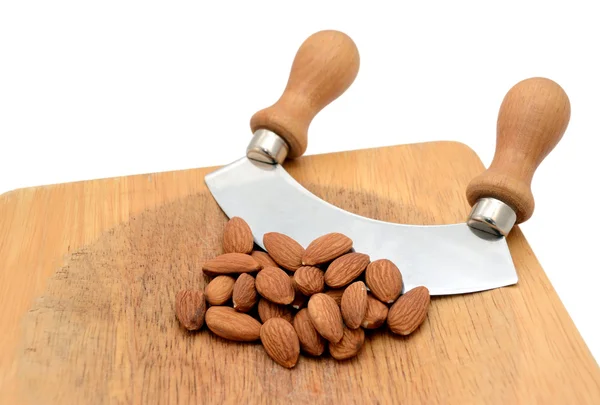 Whole almonds with a rocking knife — Stock Photo, Image
