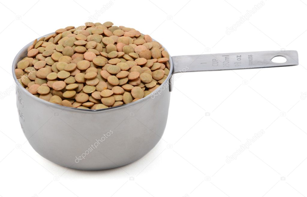 Green lentils in an American cup measure