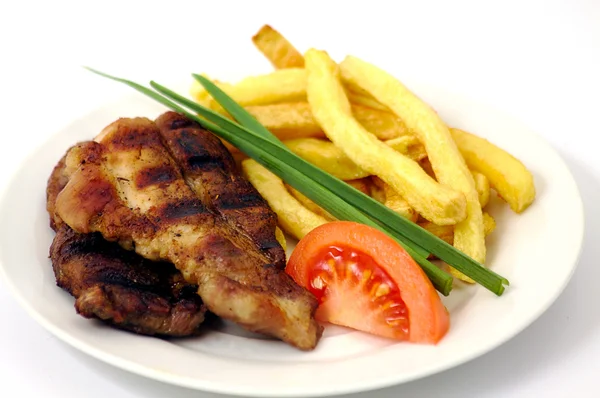 Carne alla griglia con patatine fritte Fotografia Stock