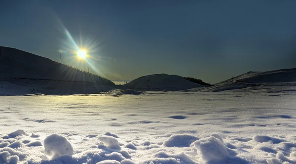 Sun over snow Stock Photo