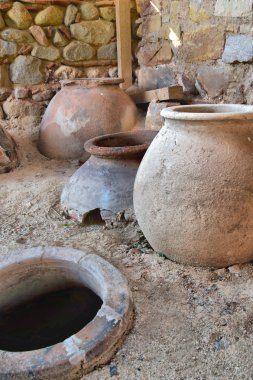 Old clay pot excavations into ancient city ruins close up clipart